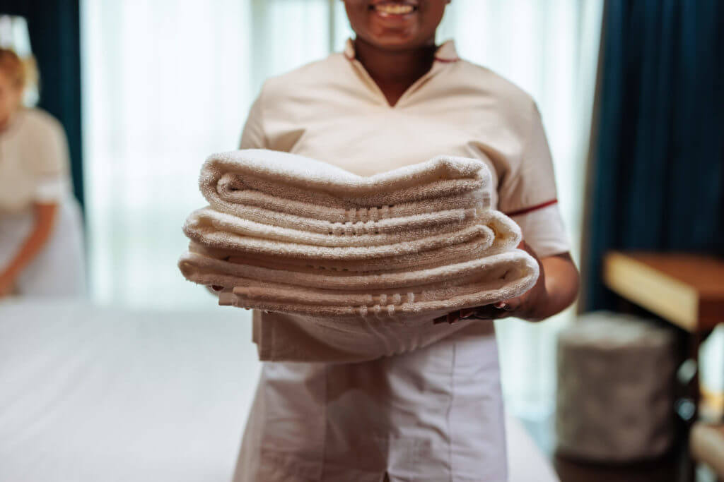 a woman holding towels 